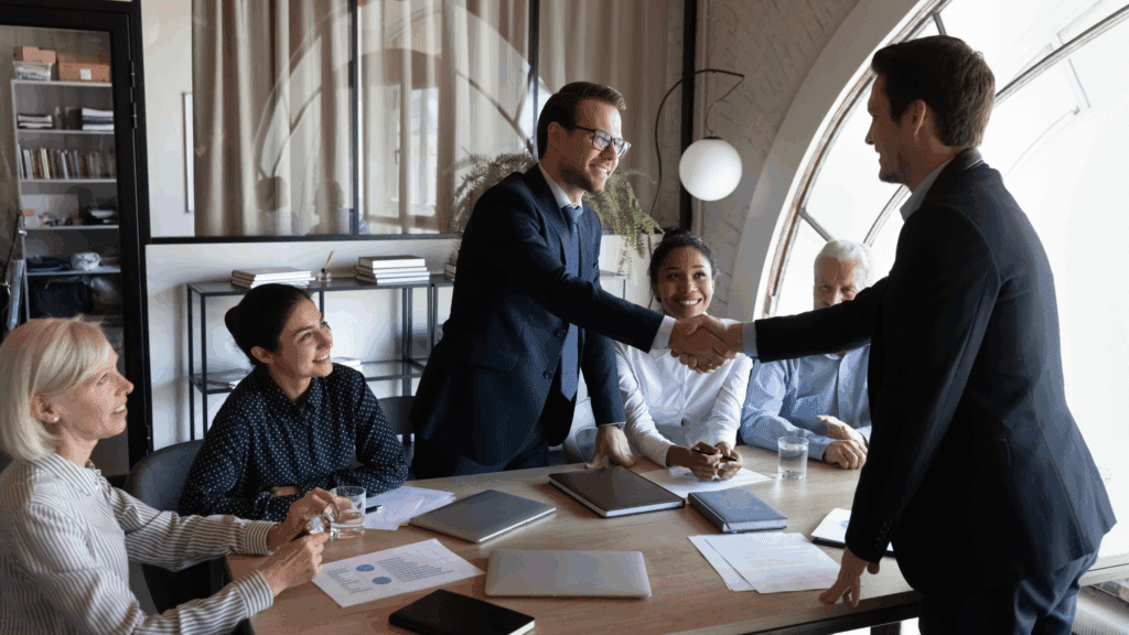 global HR managment strategy with two executives shaking hands